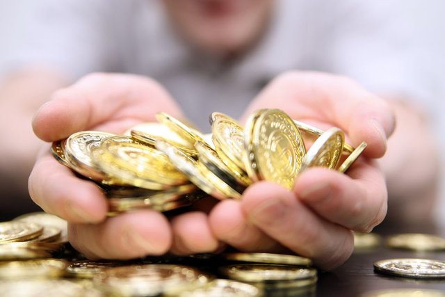 Handful-of-gold-coins-GettyImages-157405688-56a1796e3df78cf7726b0219.jpg