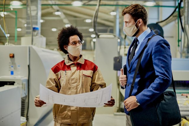 black-female-worker-explaining-design-plans-company-manager-who-is-visiting-factory-facility-coronavirus-pandemic_637285-11979.jpg