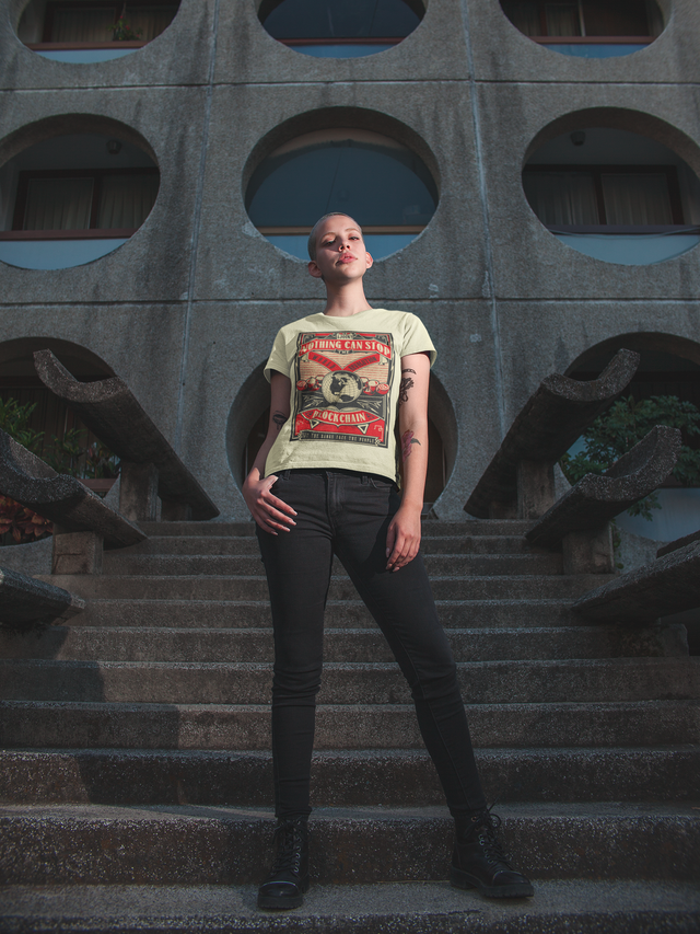 t-shirt-mockup-of-a-beautiful-woman-with-a-buzz-cut-haircut-in-front-of-a-building-18122.png