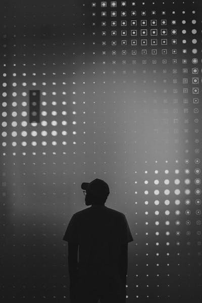 free-photo-of-silhouette-of-man-standing-in-front-of-a-wall-of-dots.jpeg