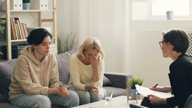 free-photo-of-three-women-sitting-on-a-couch-talking-to-each-other.jpeg