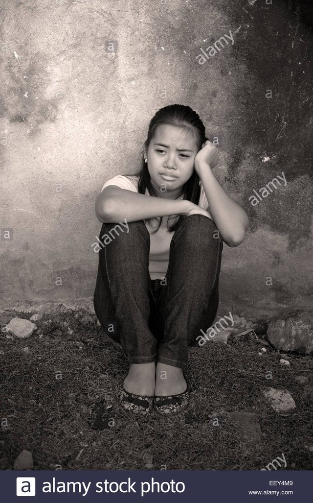 young-asian-lady-crying-in-an-abandoned-place-EEY4M9.jpg