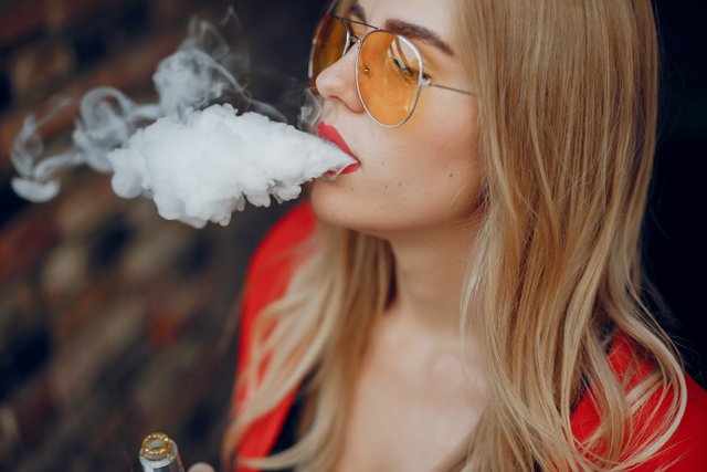 stylish-young-girl-city-with-vape.jpg