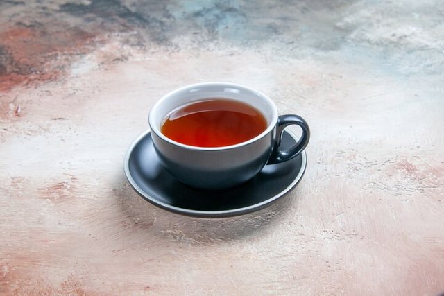 side-close-up-view-cup-tea-black-cup-tea-table_140725-73882.jpg