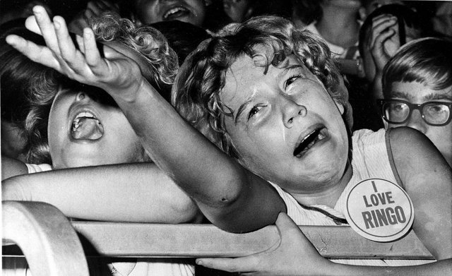 a-tearful-beatle-lover-pleads-unsuccessfully-with-a-policeman-to-carry-her-fan-button-to-ringo-at-a-beatles-concert-on-september-4-1964.jpg