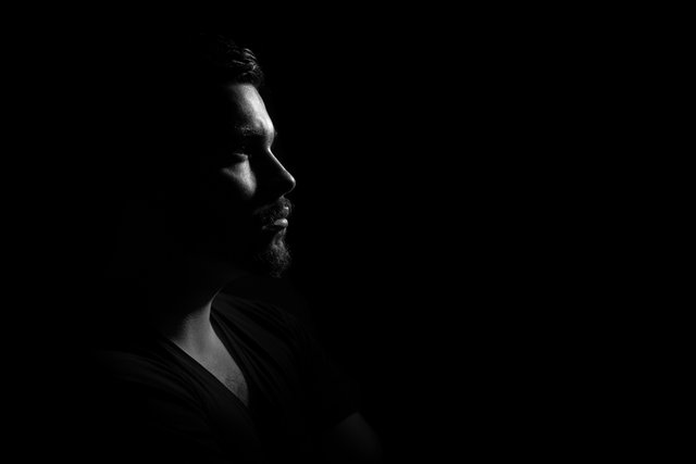 Canva - Grayscale Photo of Man in Black V Neck Shirt With Black Background.jpg