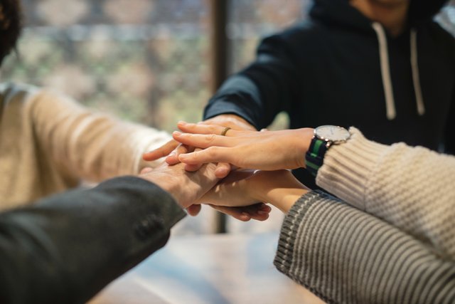 diverse-people-stacking-hands-together.jpg