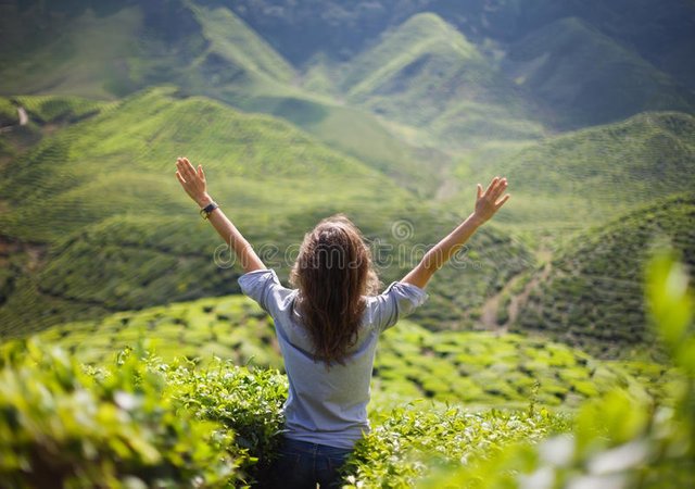 freedom-girl-hands-up-mountains-52044837.jpg