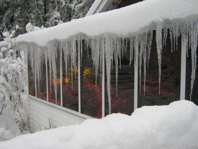 long icicles on front of sunroom good.JPG