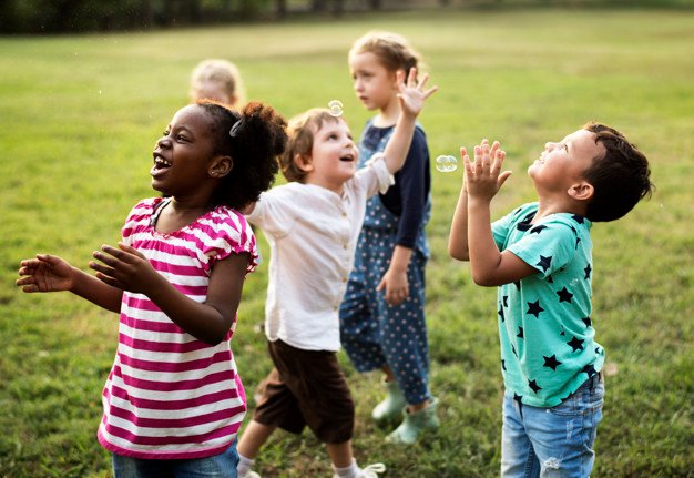 group-diverse-kids-playing-field-together_53876-70165.jpg