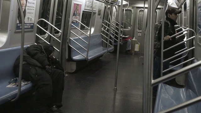 subway-train-with-homeless-man-asleep-on-seat-in-nyc_nykpmzije__F0000.png