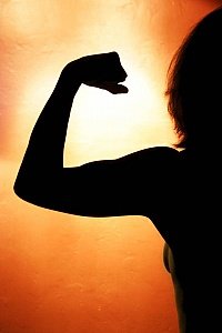 healthy-woman-flexes-muscles.jpg