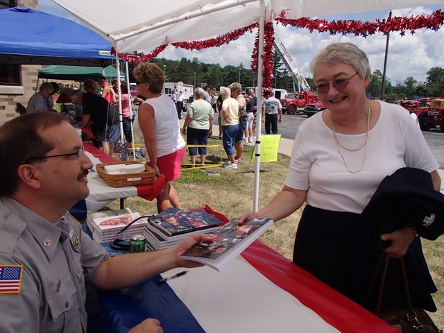 Sue Glick gets signed Smoky Days.jpg