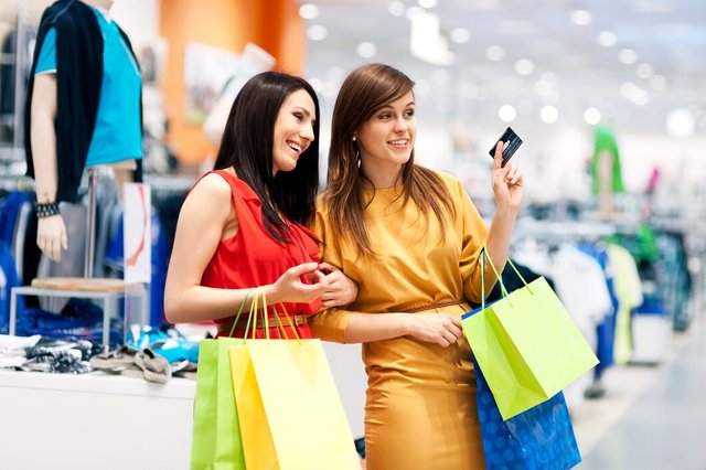 two-girlfriends-with-shopping-bags_329181-8081.jpg