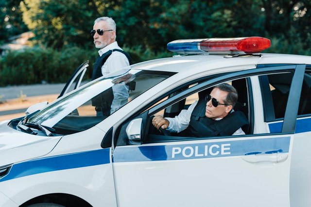 stock-photo-middle-aged-male-police-officers.jpg