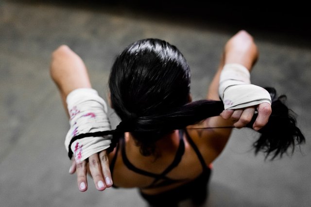 girl-boxing-ties-hair.jpg