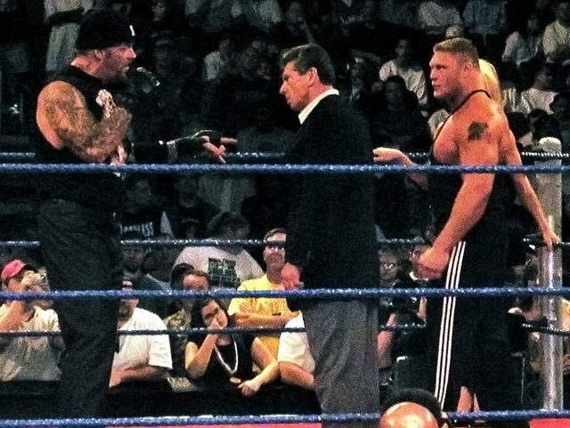 Undertaker,_Vince_McMahon,_Brock_Lesnar,_&_Sable_in_a_WWE_ring.jpg