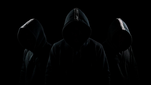 videoblocks-mysterious-hooded-man-standing-in-the-dark_bzn3gysre_thumbnail-full01.png