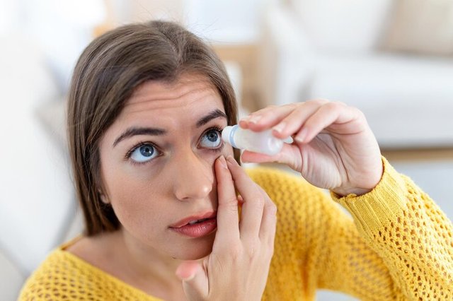 woman-using-eye-drop-woman-dropping-eye-lubricant-treat-dry-eye-allergy_657921-428.jpg