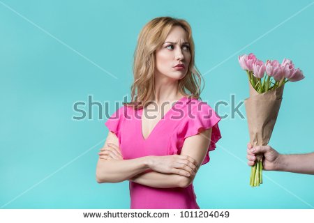 stock-photo-i-am-sorry-offended-girl-is-looking-bouquet-of-tulips-in-male-hand-with-hesitation-she-is-1011204049.jpg