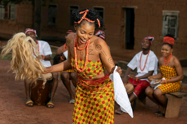 medium-shot-nigerian-woman-dancing-outdoors_23-2149029481.jpg