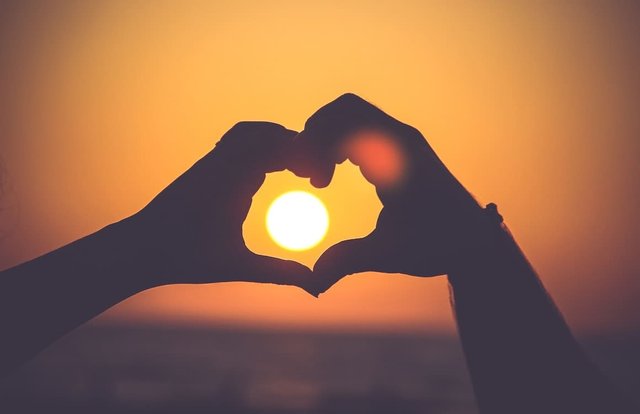 woman-using-her-hands-to-create-a-heart-shape-using-her-hands.jpg