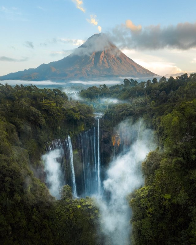 Tumpak Sewu waterfall at sunrise with Mt. Semeru in the back. Scenes straight out of Jurassic Park..jpg