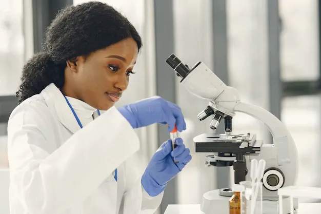 medical-doctor-girl-working-with-microscope-young-female-scientist-doing-vaccine-research_1157-48128.webp