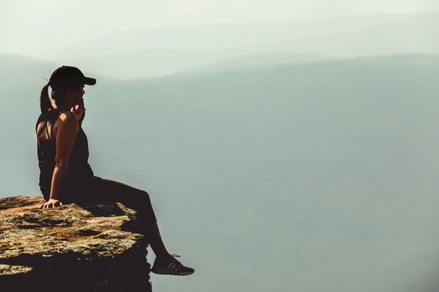 canva-woman-sitting-on-cliff-MADGv2m792E.jpg