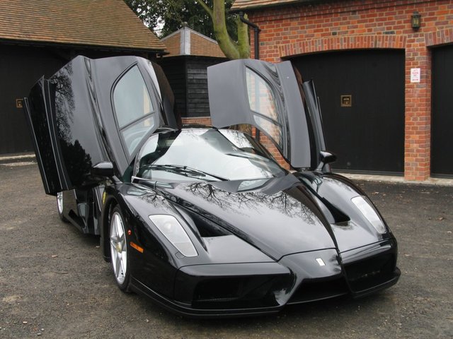 jamiroquai-Ferrari-Enzo-front-side-view-doors-open.jpg