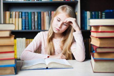 depositphotos_139075750-stock-photo-beautiful-little-girl-reading-a.jpg