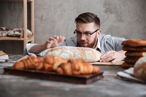 graphicstock-image-of-young-concentrated-man-baker-standing-at-bakery-near-bread-looking-aside_BO-MiW9tal_thumb.jpg