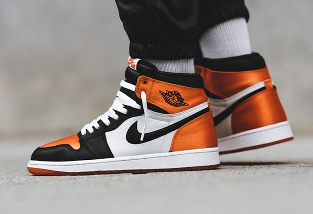 air-jordan-1-retro-satin-orange-shattered-backboard-for-sale-on-feet-(1).jpg