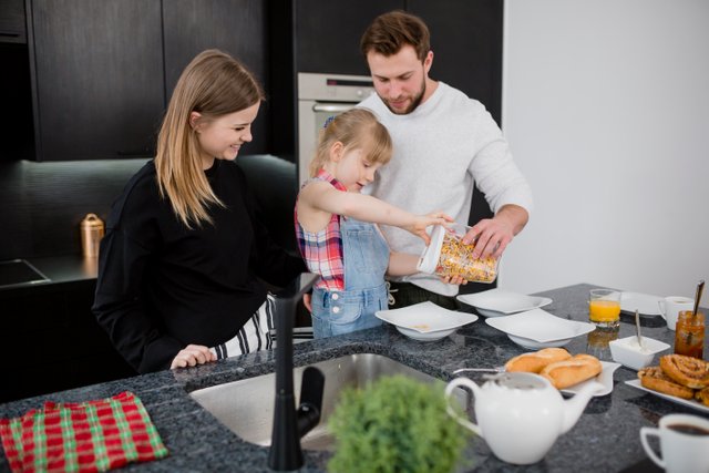 daughter-helping-parents-prepare-breakfast.jpg