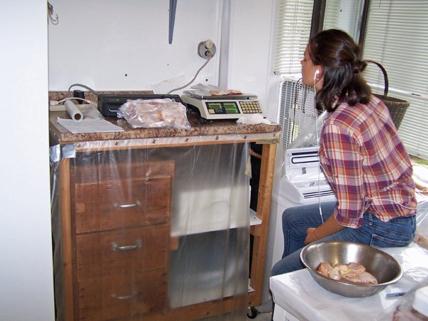 Arissa weighing chicken crop Sept. 2019.jpg