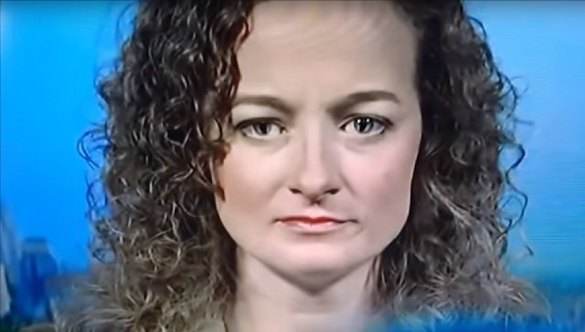 Alien reptilian woman shapeshifting on television.jpg