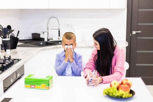 young-mother-stay-with-her-sick-son-kitchen-give-tratments-kitchen_231208-1056.jpg