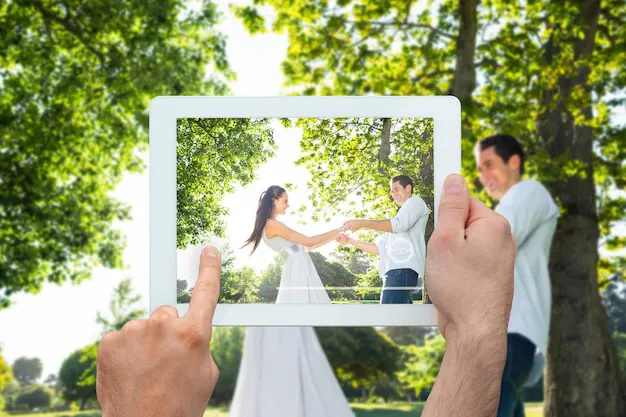 hand-holding-tablet-pc-showing-happy-couple-park_1134-52205.webp