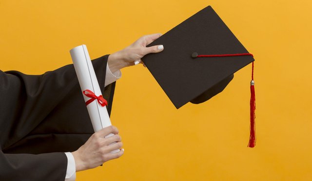 close-up-hands-holding-diploma-cap-scaled.jpg