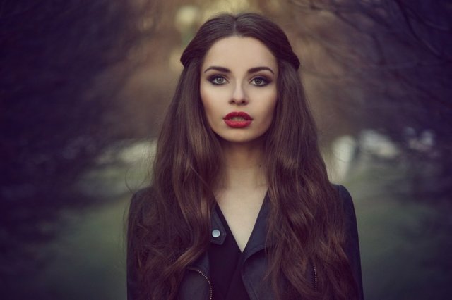 Art-portrait-of-beautiful-lonely-girl.-Pretty-woman-with-long-dark-hair-and-red-lips-posing-in-forest-and-looking-at-you.-Shallow-DOF-805x536.jpg