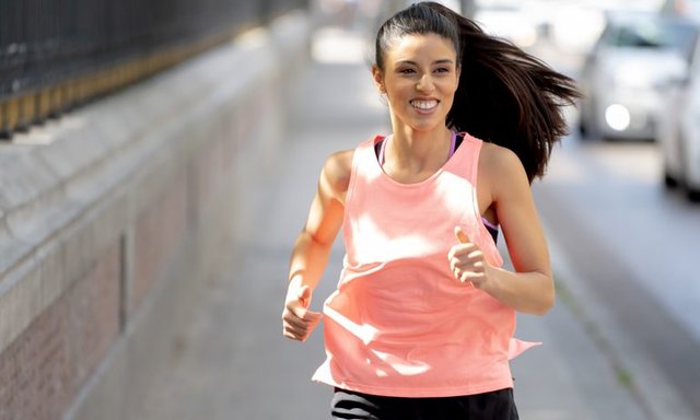 young-woman-running-along-sidewalk-768.jpg