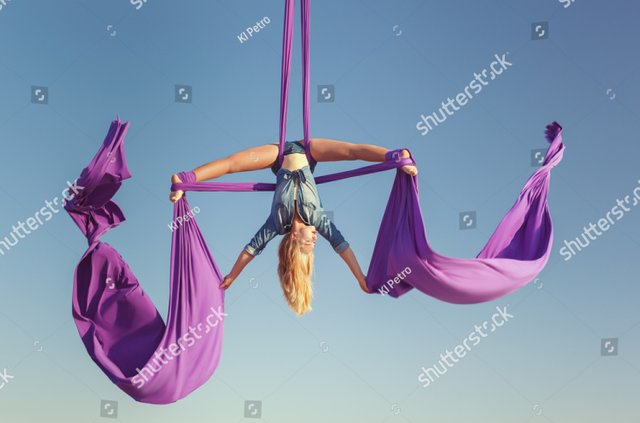 stock-photo-air-acrobat-spread-her-wings-she-performs-complex-figures-775480015.jpg