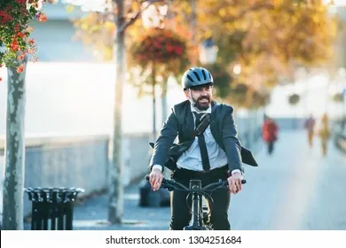 hipster-businessman-commuter-electric-bicycle-260nw-1304251684.webp