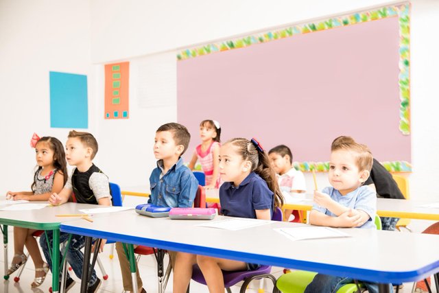 group-preschool-pupils-paying-attention-their-teacher-looking-interested-classroom.jpg