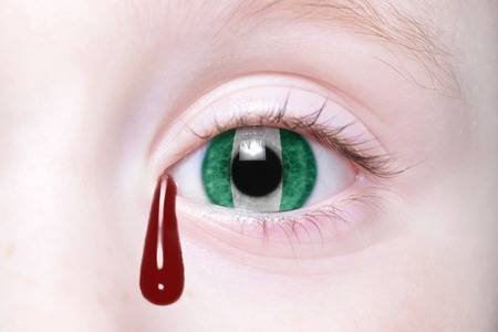 55080459-human-s-eye-with-national-flag-of-nigeria-with-bloody-tears-concept.jpg