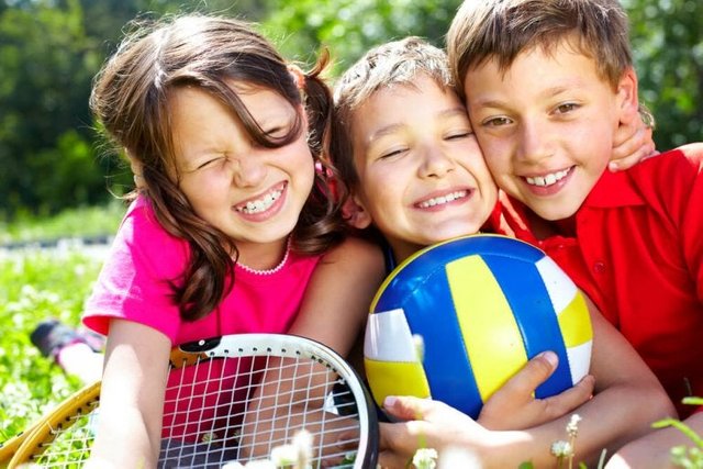 three-children-with-sports-equipment-embracing-1-768x512.jpg