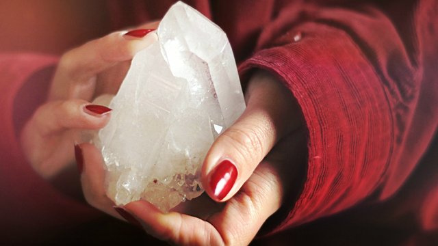 close-up-photo-of-person-holding-crystal-stone-1548091.jpg