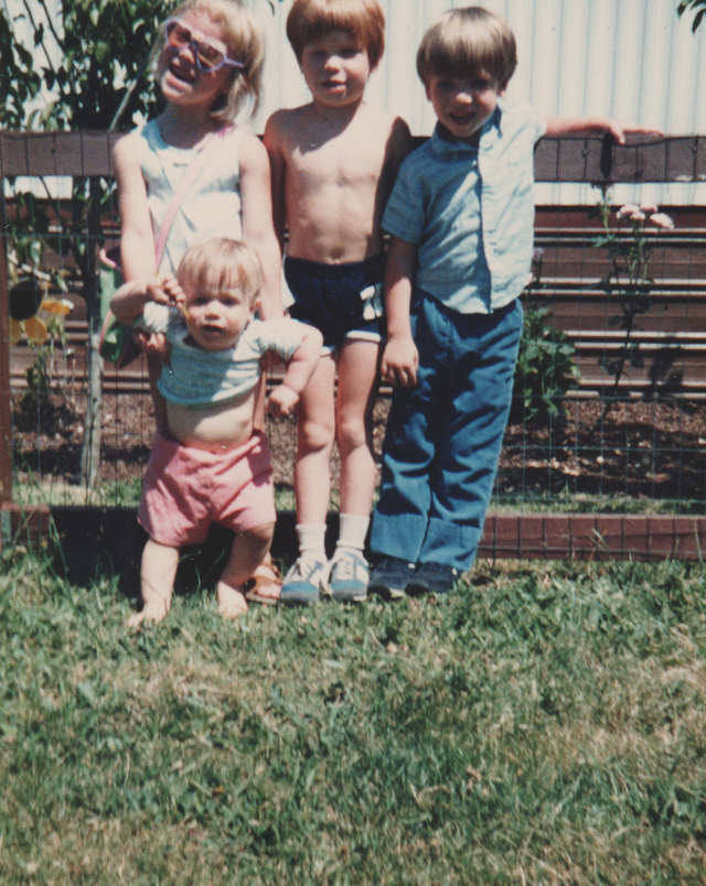 1986-06 Joey Siblings Friend Stand Holding Outside.png