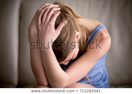 sad-teenager-crying-alone-holding-450w-712283341.jpg