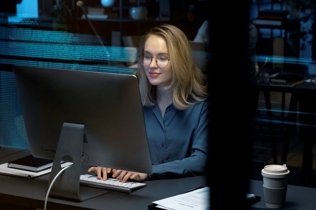 medium-shot-woman-working-computer1.jpg